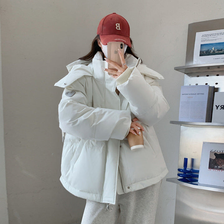 Damen Oversize Steppjacke mit Kapuze | Thermowattierte Winterjacke mit wasserabweisender Oberfläche und Reißverschlusstaschen