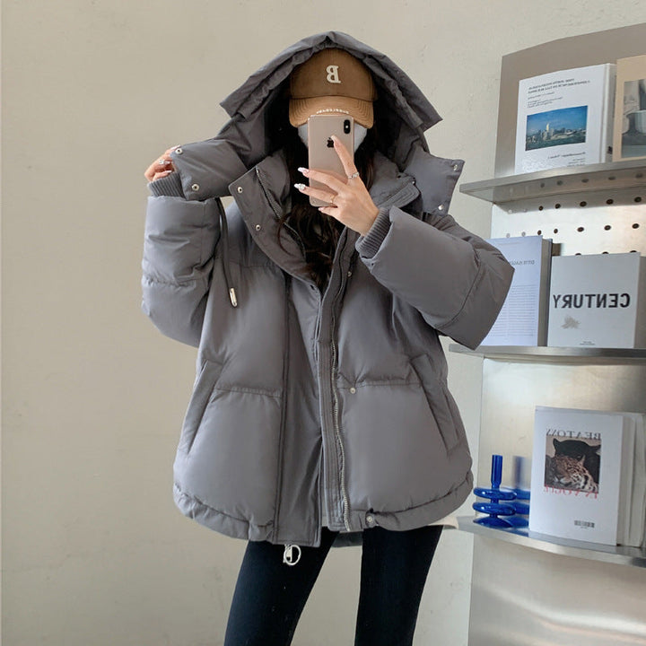 Damen Oversize Steppjacke mit Kapuze | Thermowattierte Winterjacke mit wasserabweisender Oberfläche und Reißverschlusstaschen