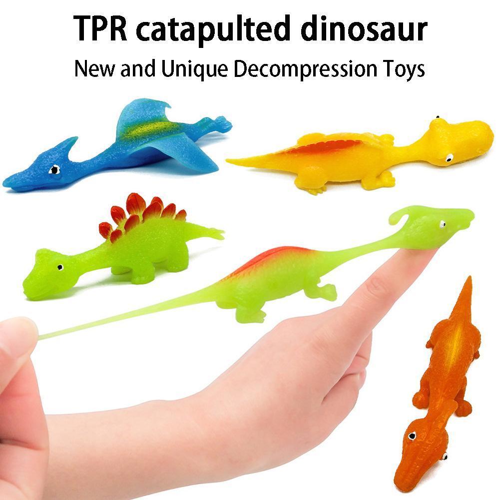 Dinosauruksen heittoliina lelu 5 kpl | Pehmeä TPR-laukaisin tarttuvalla pinnalla | Juhlaherkku sisä- ja ulkokäyttöön | 11,5 cm | Väri satunnainen