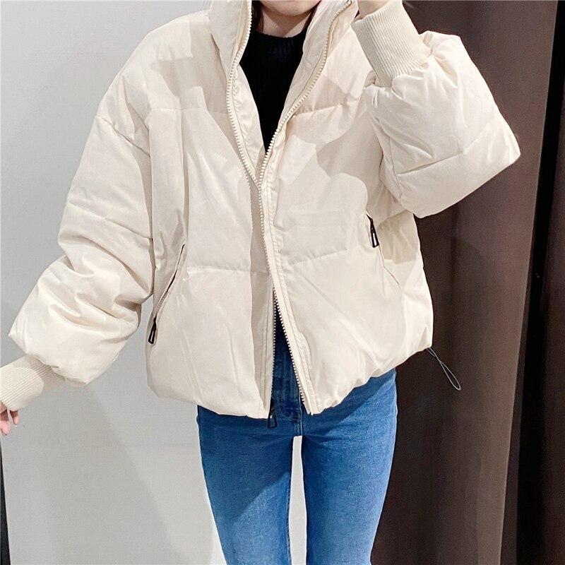 Damen Winterjacke mit hohem Kragen | Gepolsterte wasserabweisende Jacke mit Taschen, Rippbündchen und verstellbarem Saum