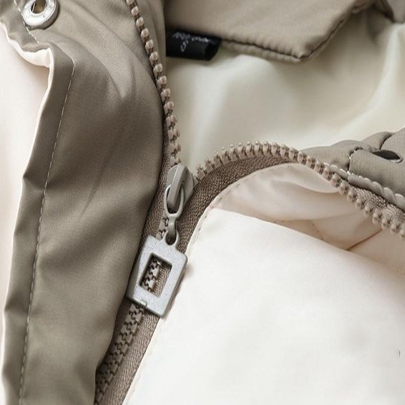 Damen Pufferjacke mit Kapuze | Hüftlange Steppjacke mit Rautensteppung, geradem Schnitt und asymmetrischem Design für Winter